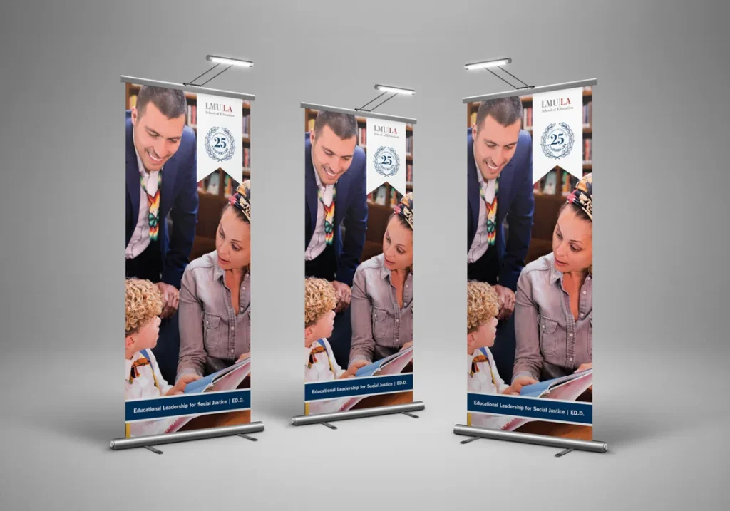 Three pull-up banners with a teacher and young students